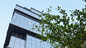 A building with a sign reading "AQUILA A-152, SECTOR 136 NOIDA". - Aquila Grand Suites (Noida)