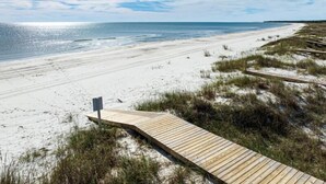 A wooden boardwalk leading to a sandy beach with dunes and a clear blue sky. - Port St Joe Beach House Pool 5BR Sleeps 12 by RedAwning (Port St. Joe)