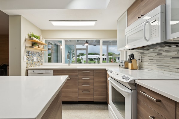 House, 4 Bedrooms | Private kitchen | Fridge, oven, coffee/tea maker, toaster - Marlin Manor 4 Bedroom Home by RedAwning (Cocoa Beach)