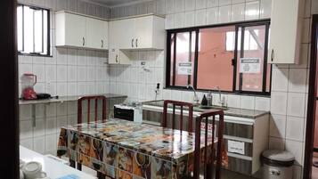 Full-size fridge, microwave, oven, cookware/dishes/utensils