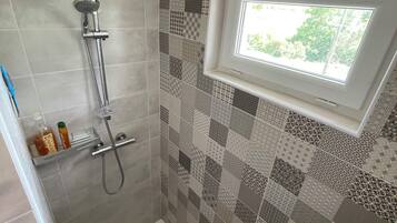 Shower, hair dryer, towels, soap