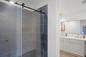 Shower, hair dryer, towels, soap