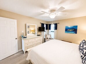 A bedroom with a bed, dresser, ceiling fan, and artwork on the wall. - Jetty View at Jetty East! One FREE Beach Chair Setup Each Day of Your Stay! (Destin)
