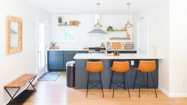 A modern kitchen with a central island, bar stools, and pendant lighting. - 5 Min to Downtown Warwick, Wineries, Breweries, Hikes, Shops, & Greenwood Lake! (Warwick)