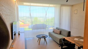 Luxury Cabin, Balcony, Hill View | Living area | 50-inch Smart TV with digital channels, streaming services - Stock & Stein Lodges (Bad Gleichenberg)