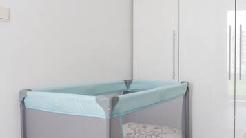 1 bedroom, desk, iron/ironing board, travel crib