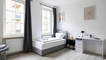 1 bedroom, desk, iron/ironing board, travel crib