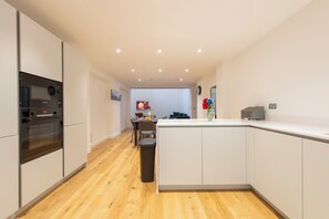 Enjoy cooking in this well-lit kitchen with oven and central island.