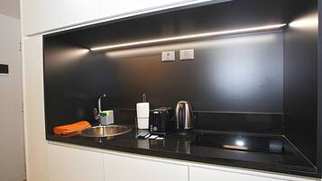 Microwave, stovetop, toaster, cookware/dishes/utensils