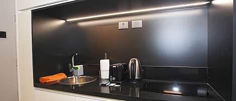 Microwave, stovetop, toaster, cookware/dishes/utensils