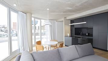 Deluxe Apartment | Living area | 45-inch LED TV with cable channels