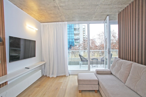 Deluxe Apartment | Living area | 45-inch LED TV with cable channels