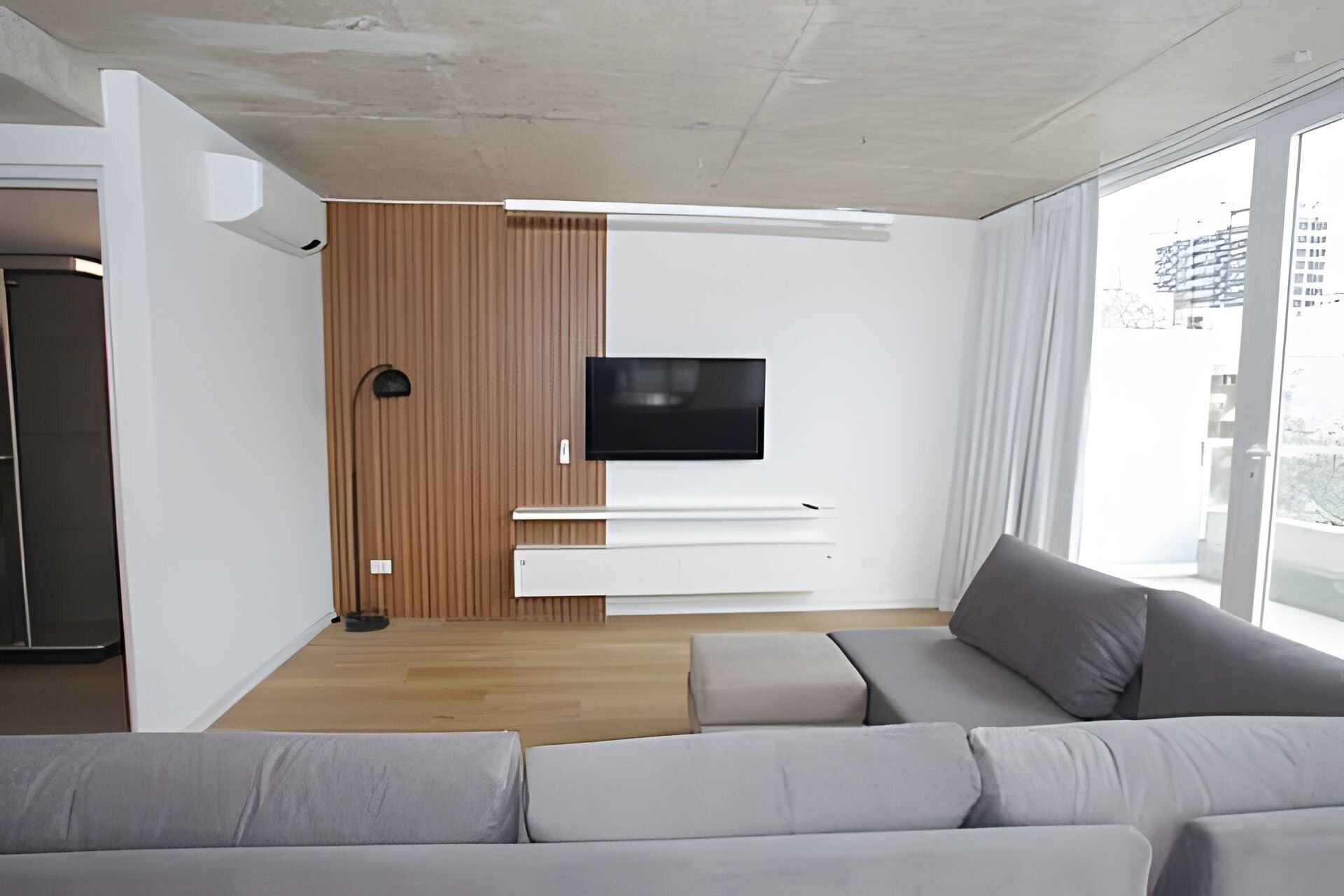 Deluxe Apartment | Living area | 45-inch LED TV with cable channels