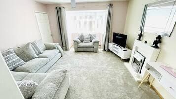 House | Living area | TV, fireplace