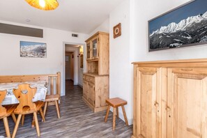 A wooden dining area with a table and chairs, a small stool, and a cabinet with the word 'Personnel' on it. - 70m from ski slopes, Ground floor, balcony, tv, 43m², La Clusaz (La Clusaz)