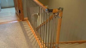 A wooden staircase with a metal handrail leading to an upper floor. - 3 min walk in to town , Great location in town (kinsale)