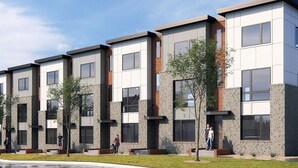 A modern residential building with a flat roof, large windows, and a mix of brick and concrete facades. - Tailgater's Dream! Rooftop w/ TV + Fire + Lights (Nashville)