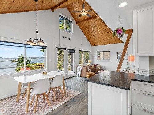 Darling pink beach house with epic views in a cozy community.