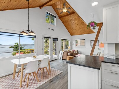 Darling pink beach house with epic views in a cozy community.