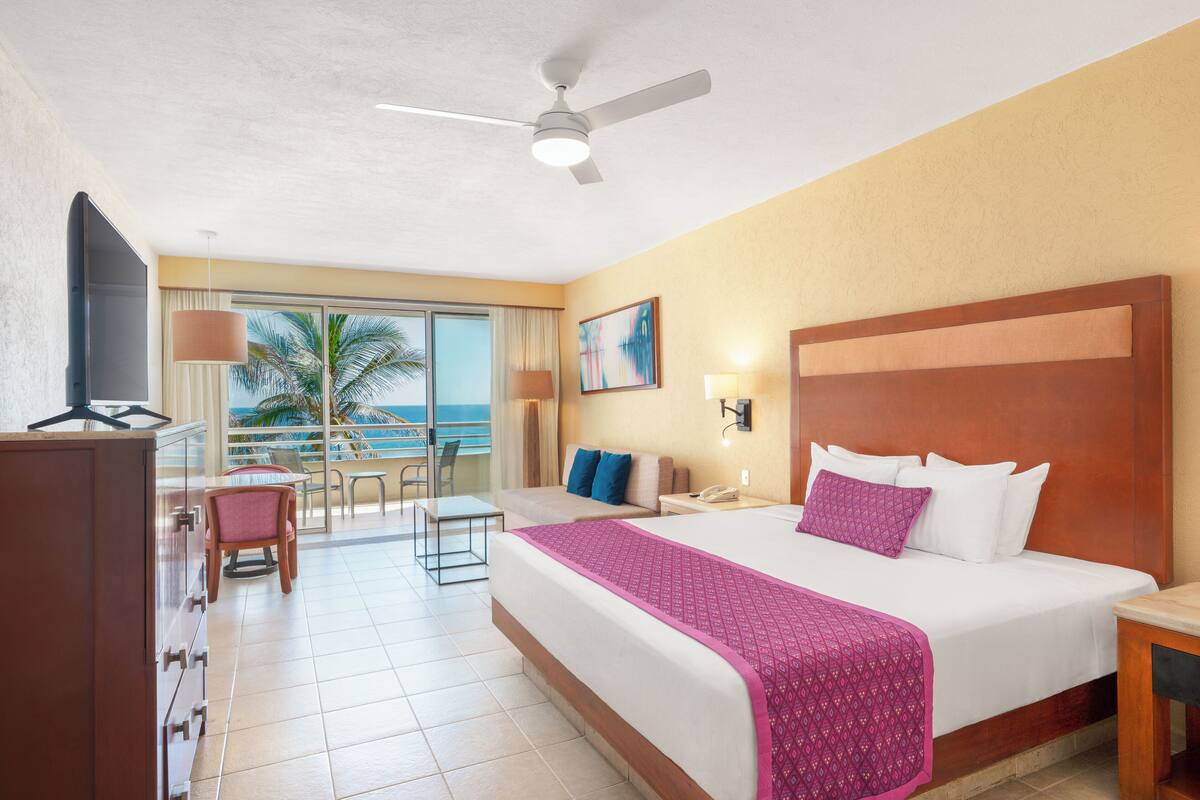 Superior Room, Balcony, Beachfront | Minibar (free items), in-room safe, desk, laptop workspace