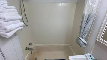 Combined shower/tub, hair dryer, towels, soap