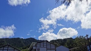 A traditional Japanese building with a sign reading "Yamanouchi Hotel". - Yunxiu Inn (Zhangjiajie)