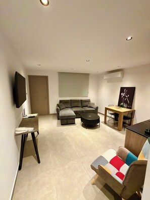 Superior Apartment, Balcony, City View | Living area | Flat-screen TV - Living Boutique Apartments (Ayia Napa)