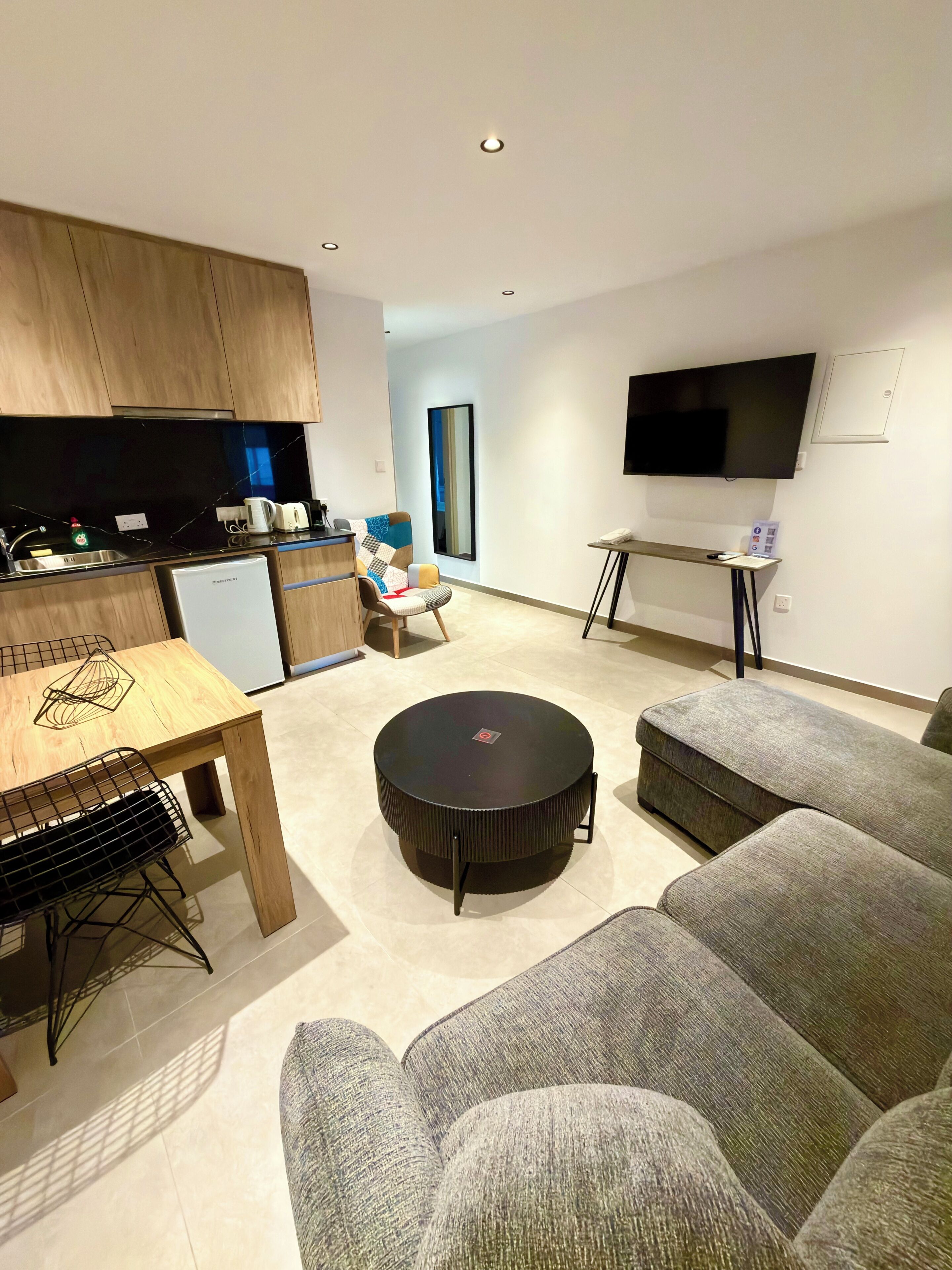 Superior Apartment, Balcony, City View | Living area | Flat-screen TV