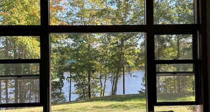 BEAUTIFUL lake front home with a private beach, dock and large yard