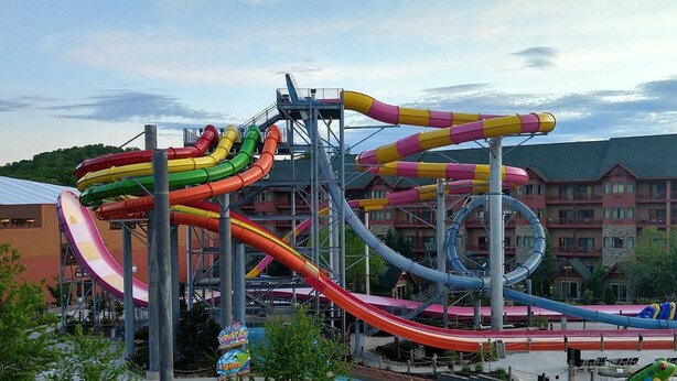 A water park with multiple slides and a pool area. - 1Bed Deluxe at Great Smokies Lodge! (Sevierville)