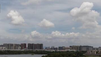A cityscape with high-rise buildings and a body of water.