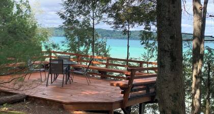 Torch lake waterfront:100 ft of sandy beach, 3-bedroom, 3-bath cottage