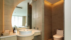 A modern bathroom with a double sink vanity, a toilet, and a large mirror. - Timberton Resort Khaoyai (Pak Chong)