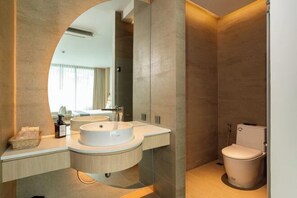 A modern bathroom with a double sink vanity, a toilet, and a large mirror. - Timberton Resort Khaoyai (Pak Chong)