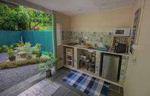 Fridge, microwave, coffee/tea maker, cookware/dishes/utensils