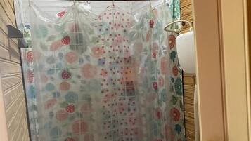 Bathtub, towels, toilet paper