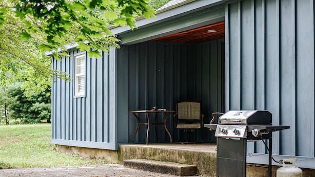 A covered outdoor area with a grill and a table. - Bluebird Cottage: Near 151 + Appalachian Trail (Roseland)