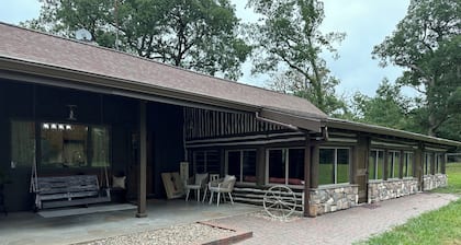 Spacious 5-bedroom log cabin home with 2 ponds and 50 acres just outside Moberly