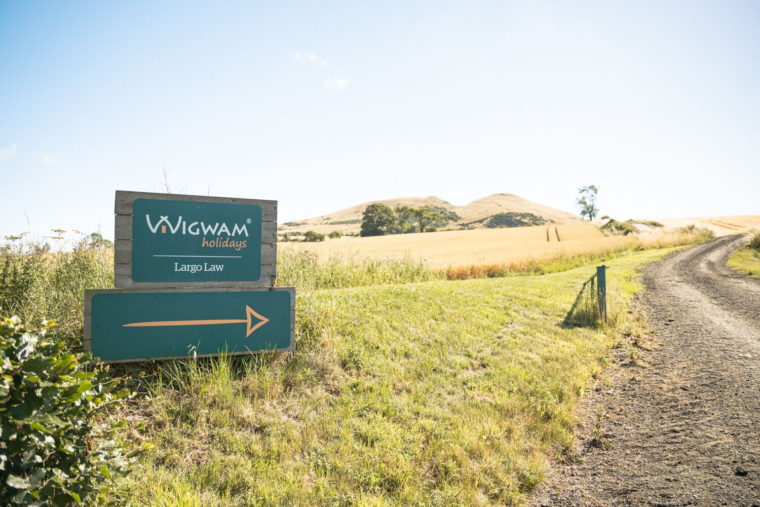 A sign for Wigwam Holidays in Largo Law with a directional arrow.