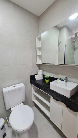 Superior Studio | Bathroom | Shower, towels, soap, toilet paper
