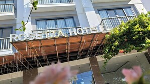 The exterior of the Rosetta Hotel with a visible balcony and a signboard. - Rosetta Hotel (Phu Quoc)