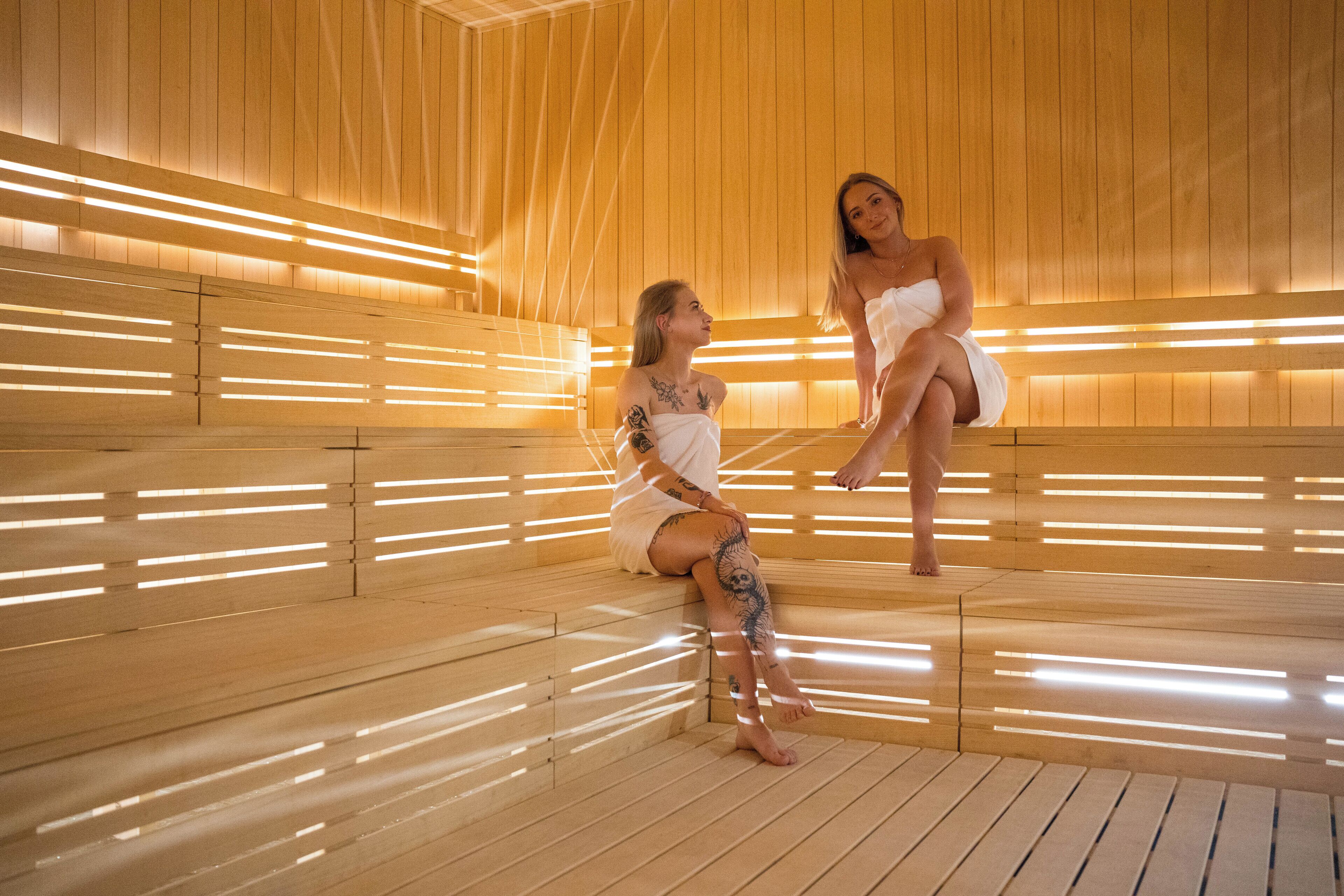 A sauna with wooden benches and slatted walls.
