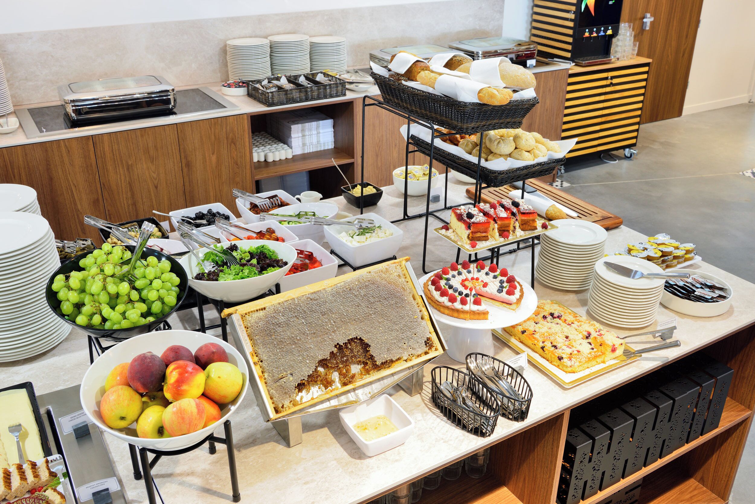 A buffet with various food items and dishes.