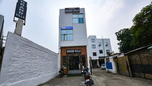 A hotel named Grand Villa with a modern facade, a visible entrance, and a sign for Fab Hotels. - Fabhotel Grand Villa (New Delhi)
