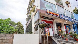 A building with a restaurant named 'Five Star' and a Domino's Pizza outlet. - Fabhotel Willow Tree (Bengaluru)
