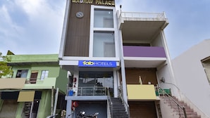 A multi-story building with a sign for 'Madhav Palace' and 'Fab Hotels'. - Fabhotel Madhav (Mathura)