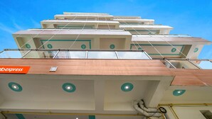 A multi-story hotel with a modern design, featuring a prominent 'abexpress' sign on the ground floor. - Fabhotel Keptown (Danapur)