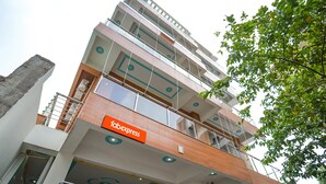 A multi-story building with a 'fabexpress' sign on the lower level, indicating a transportation hub. - Fabhotel Keptown (Danapur)