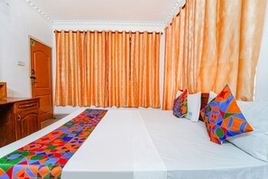 Egyptian cotton sheets, premium bedding, in-room safe, free WiFi - Fabexpress Majestic Inn (Thiruvananthapuram)