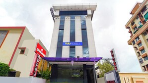 A hotel entrance with a sign for 'Tab Hotels' and a sign for 'Oube Hotel Kochi'. - Fabhotel Qube (Kanayannur)